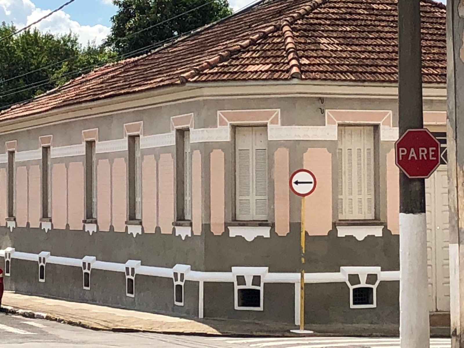 Detail of the manor's listed facade seen from the corner, with relief ornaments